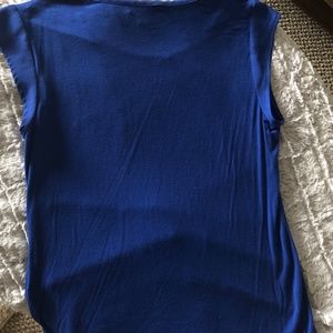 Small, blue, sleeveless, tank top with pocket